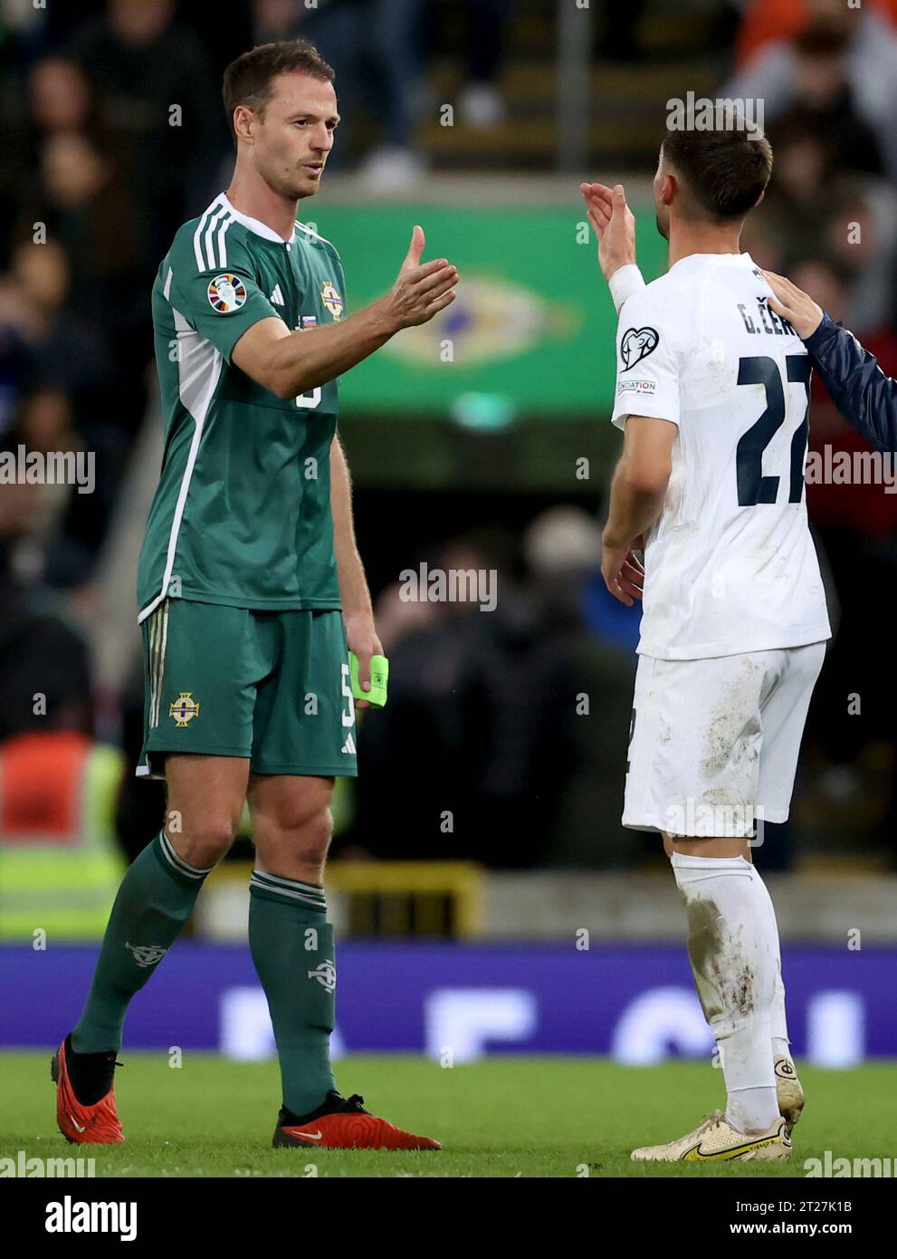 Northern Ireland's Jonny Evans and Slovenia’s Adam Cerin following the ...