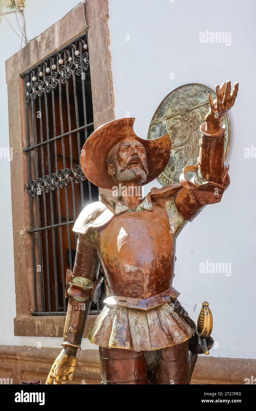 A copper statue of Spanish literary character Don Quixote in front of the Don Quijote Iconographic Museum in the historic center of Guanajuato City, Guanajuato, Mexico. Stock Photo