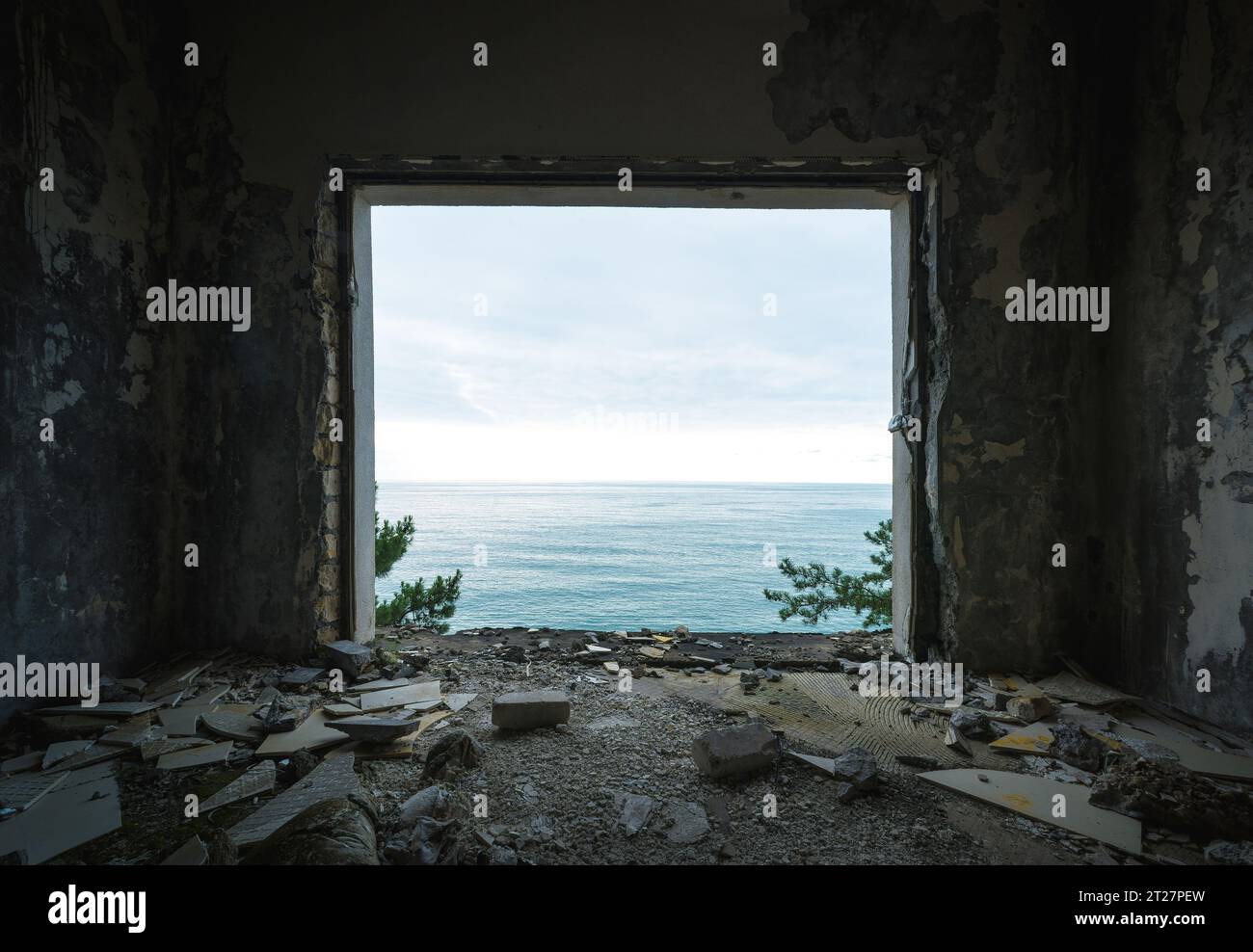 ruined apartment room with the sea window view Stock Photo