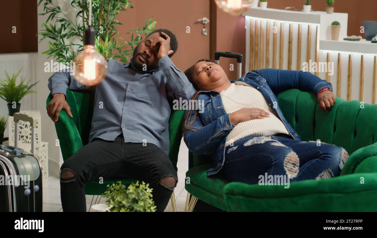 African couple sleeping on sofa hi-res stock photography and images - Alamy