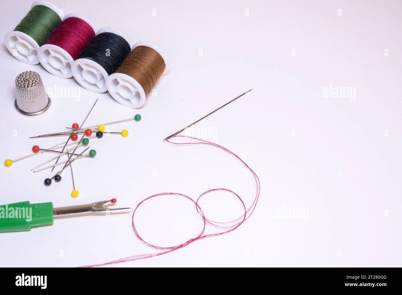 Sewing tools on a light background. Stock Photo