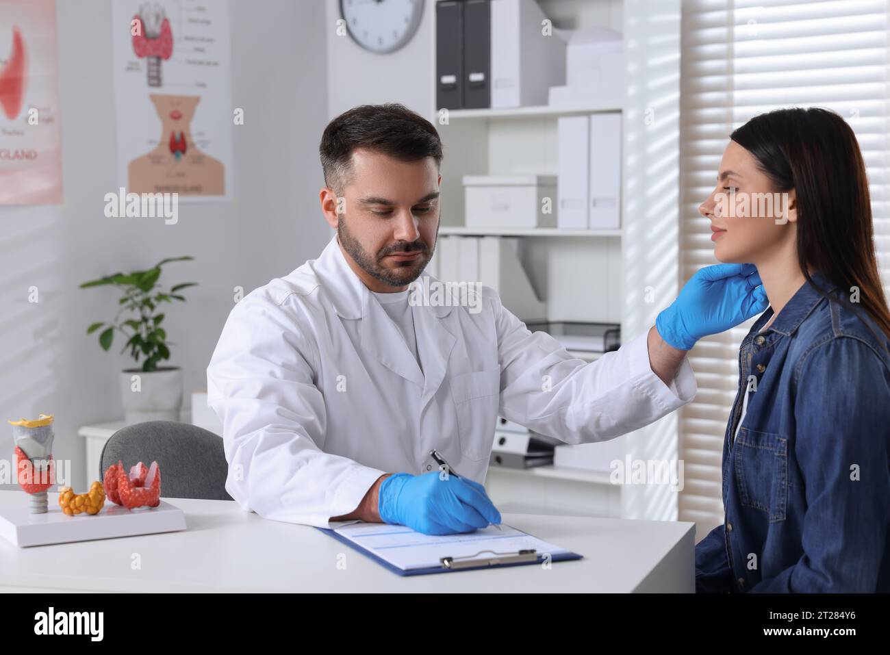 Woman having appointment with endocrinologist at hospital Stock Photo