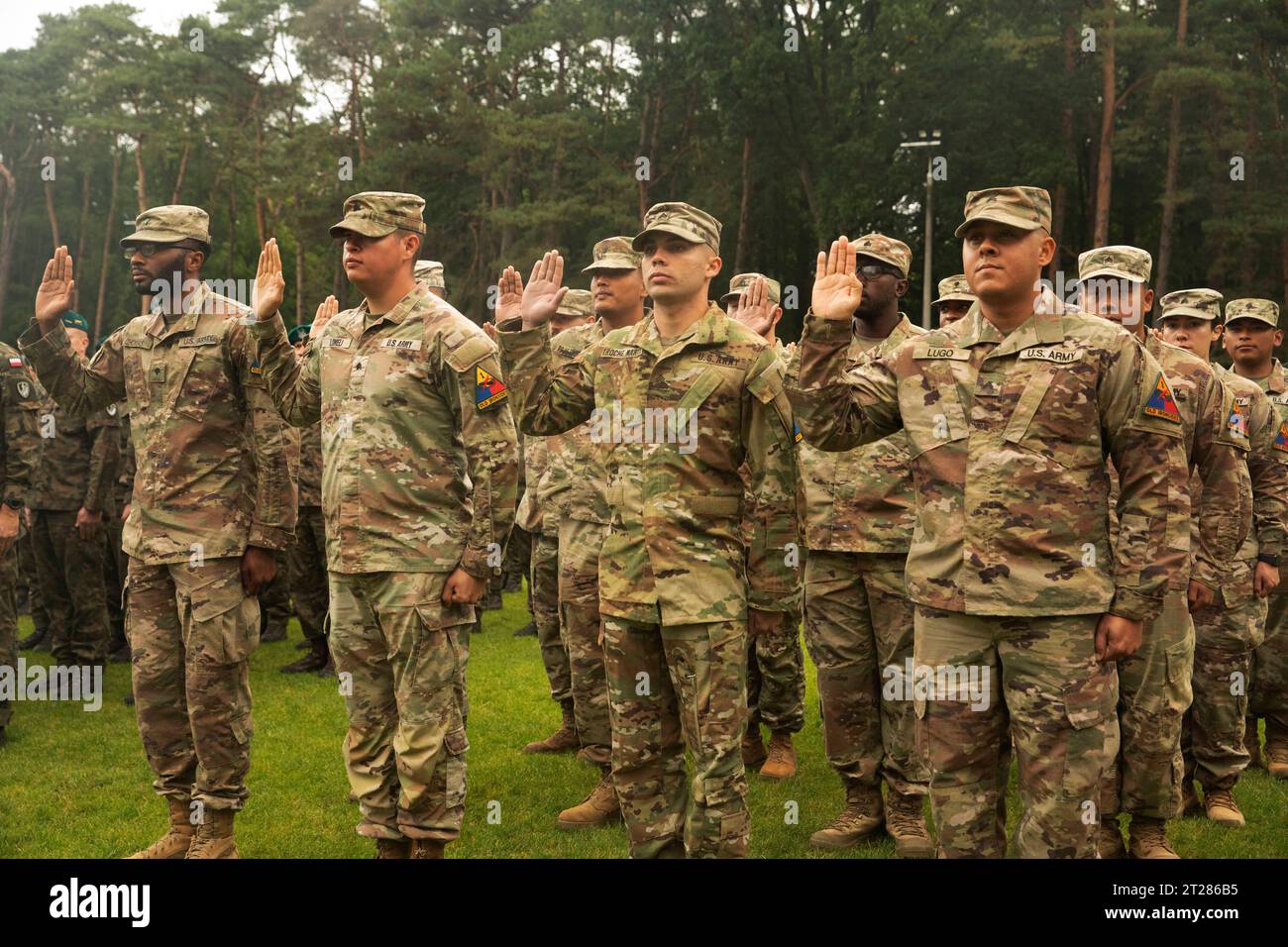 Poland. 23rd Sep, 2023. Soldiers from the 2nd Armored Brigade Combat Team, 1st Armored Division proudly recite the oath of enlistment during a joint formation with Polish soldiers on in Zlocieniec, Poland on September 23, 2023. Hosted by 2nd Mechanized Brigade, 12th Szczecin Mechanized Division, the ceremony was a testament to the relationships and camaraderie the 2nd Armored Brigade Combat Team has forged with our Polish NATO partner. (Credit Image: © U.S. Army/ZUMA Press Wire) EDITORIAL USAGE ONLY! Not for Commercial USAGE! Stock Photo