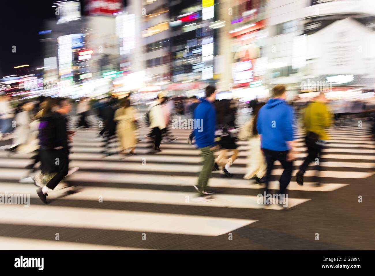 picture with camera made motion blur effect of crowds of people ...