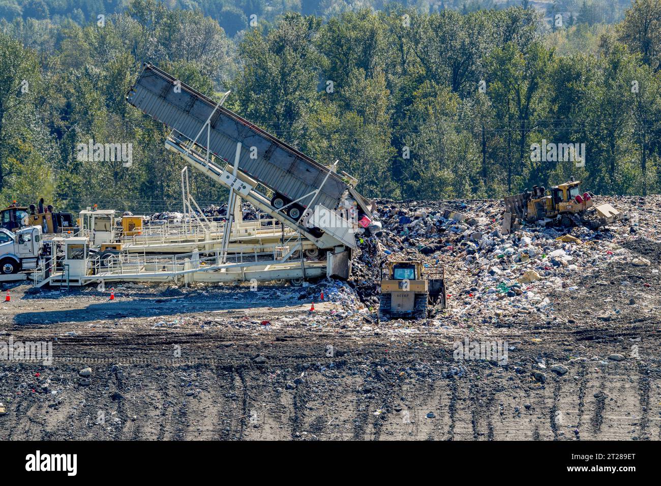Tippers unloading garbage from transfer trailers at the King County