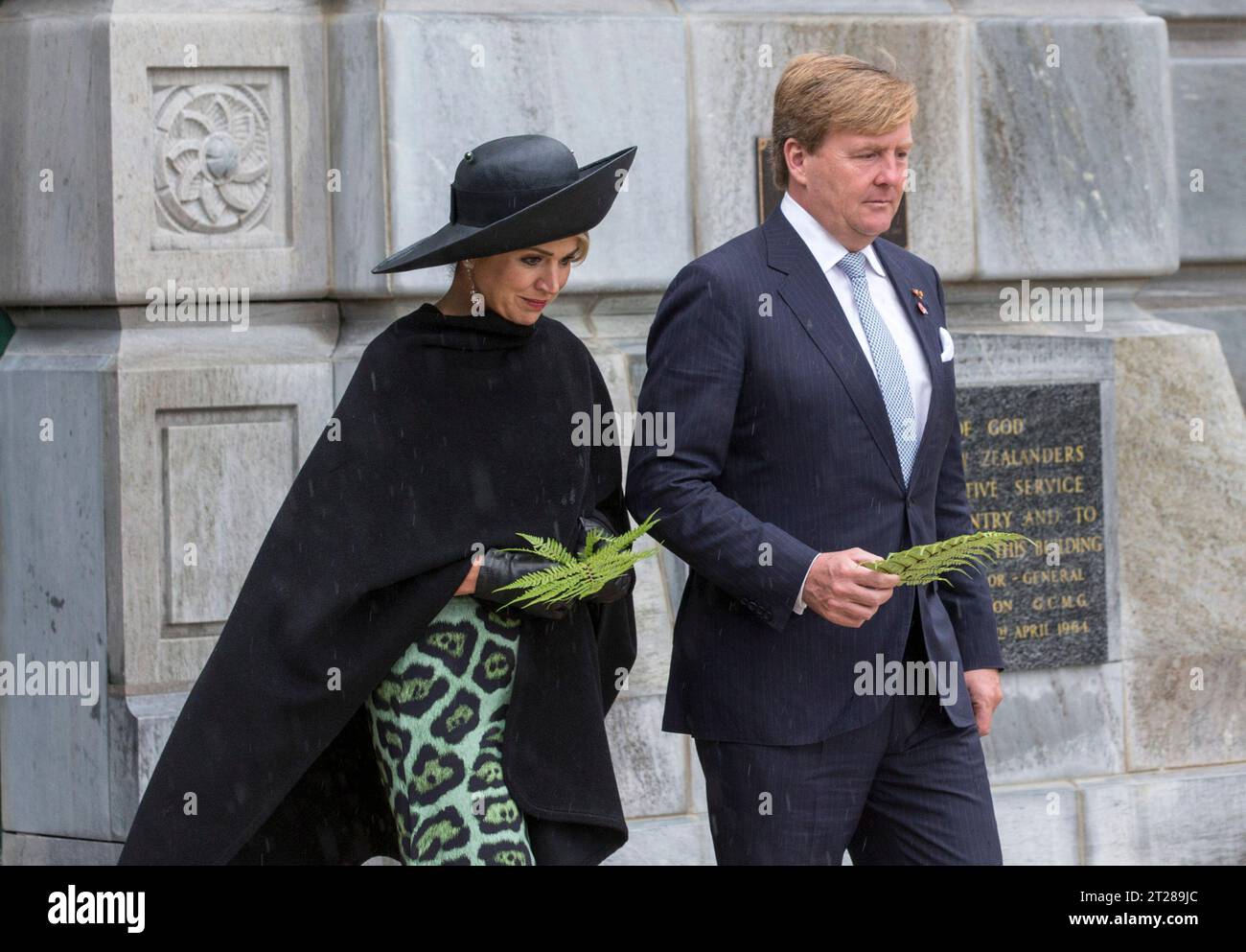 King Willem-Alexander and Queen Maxima of the Netherlands prepare to lay a silver fern at the Tomb of the Unknown Warrior at the National War Memorial, Wellington, New Zealand Stock Photo