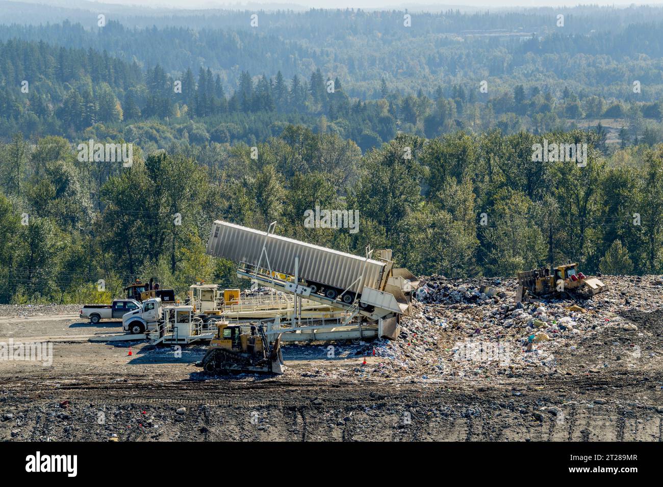 Tippers unloading garbage from transfer trailers at the King County