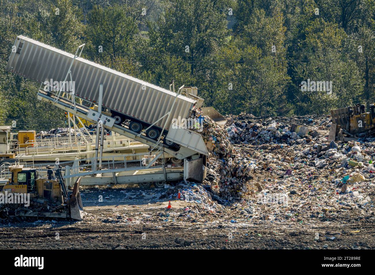 Tippers unloading garbage from transfer trailers at the King County