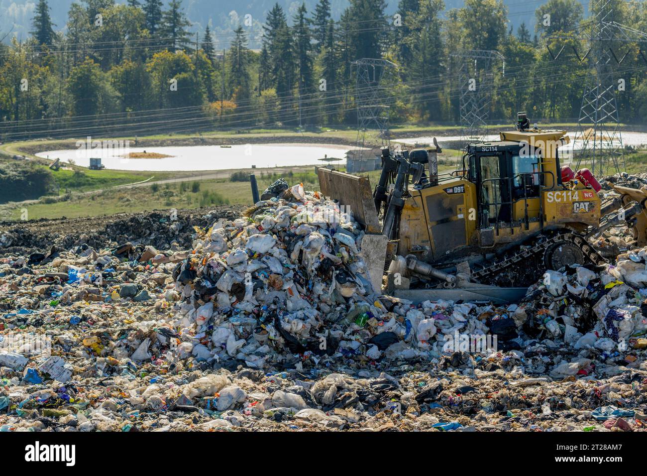 Heavy machinery is spreading the garbage at the King County Cedar Hills