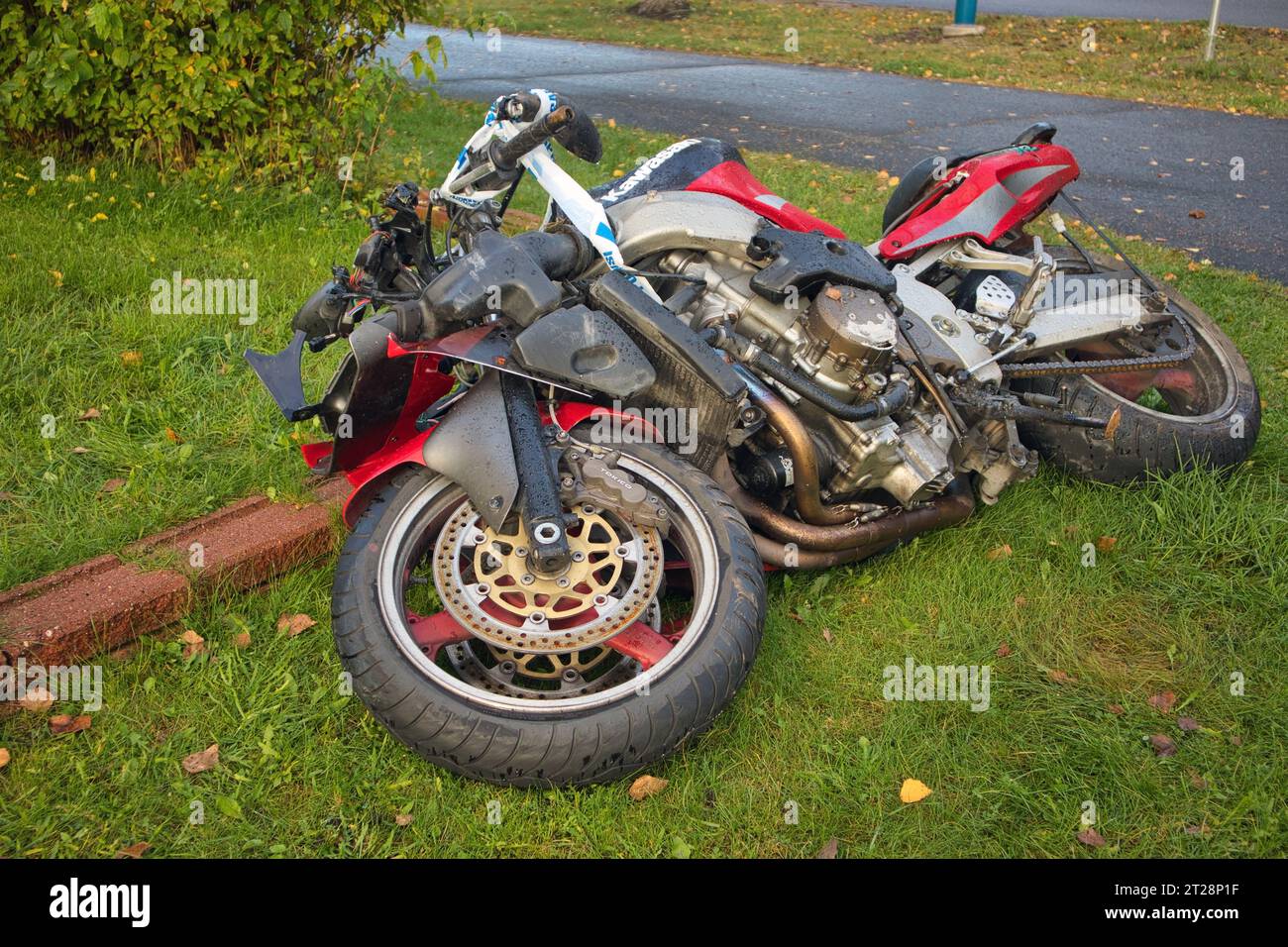 crashed motorcycle on lawn Stock Photo Alamy