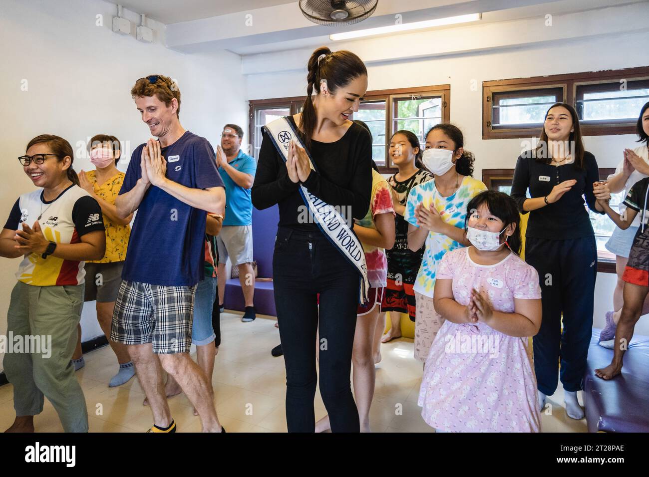 Bangkok, Thailand. 14th Oct, 2023. Tharina Botes, Miss Thailand World 2023 is seen cheering up young children and adults from Klong Toei Bangkok's biggest slum, at the Bangkok Community Help Foundation Learning and Development Center, at Klong Toei, in Bangkok. Miss Thailand World 2023, Tharina Botes, mixed Thai-South African heritage joined as a volunteer in a free weekly English program for kids and adults, organized by the Bangkok Community Help Foundation, at Klong Toei, Bangkok's biggest slum. (Photo by Nathalie Jamois/SOPA Images/Sipa USA) Credit: Sipa USA/Alamy Live News Stock Photo