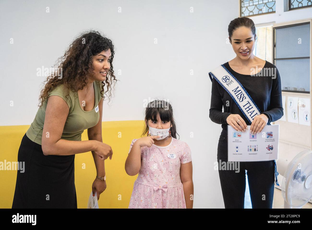 Bangkok, Thailand. 14th Oct, 2023. Tharina Botes, Miss Thailand World 2023 is seen during an English teaching class with young children from Klong Toei Bangkok's biggest slum, at the Bangkok Community Help Foundation Learning and Development Center, at Klong Toei, in Bangkok. Miss Thailand World 2023, Tharina Botes, mixed Thai-South African heritage joined as a volunteer in a free weekly English program for kids and adults, organized by the Bangkok Community Help Foundation, at Klong Toei, Bangkok's biggest slum. (Photo by Nathalie Jamois/SOPA Images/Sipa USA) Credit: Sipa USA/Alamy Live News Stock Photo