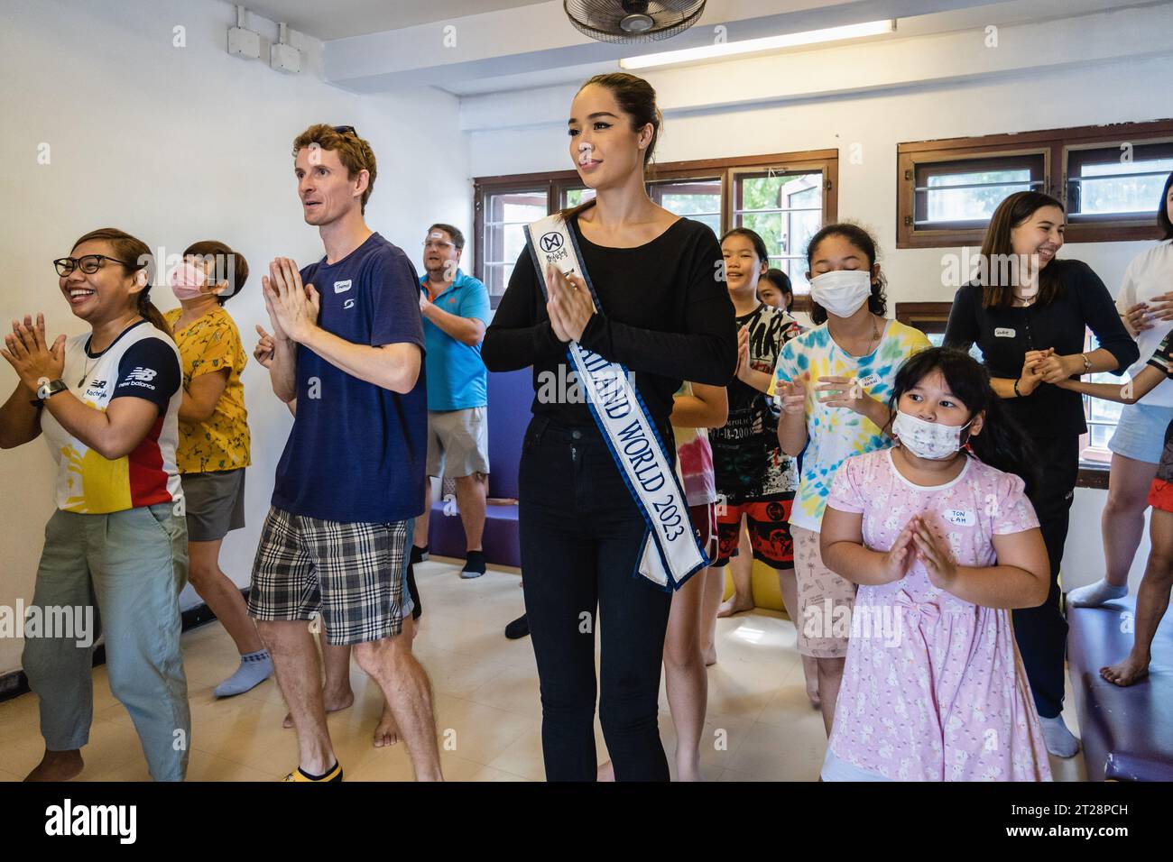 Bangkok, Thailand. 14th Oct, 2023. Tharina Botes, Miss Thailand World 2023 is seen cheering up young children and adults from Klong Toei Bangkok's biggest slum, at the Bangkok Community Help Foundation Learning and Development Center, at Klong Toei, in Bangkok. Miss Thailand World 2023, Tharina Botes, mixed Thai-South African heritage joined as a volunteer in a free weekly English program for kids and adults, organized by the Bangkok Community Help Foundation, at Klong Toei, Bangkok's biggest slum. (Photo by Nathalie Jamois/SOPA Images/Sipa USA) Credit: Sipa USA/Alamy Live News Stock Photo