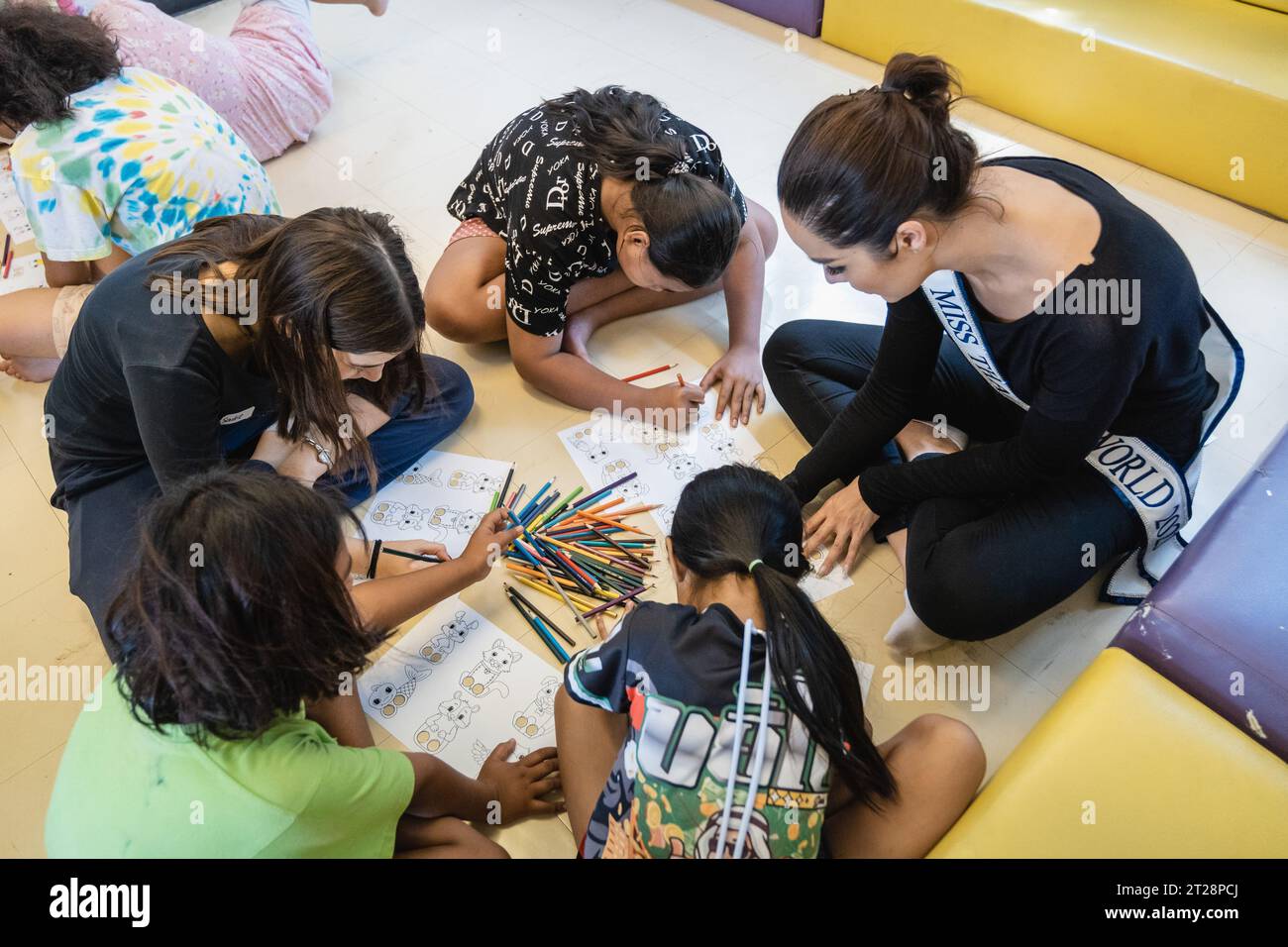 Bangkok, Thailand. 14th Oct, 2023. Tharina Botes, Miss Thailand World 2023 is seen teaching English to the kids of Klong Toei Bangkok's biggest slum, at the Bangkok Community Help Foundation Learning and Development Center, in Bangkok. Miss Thailand World 2023, Tharina Botes, mixed Thai-South African heritage joined as a volunteer in a free weekly English program for kids and adults, organized by the Bangkok Community Help Foundation, at Klong Toei, Bangkok's biggest slum. (Photo by Nathalie Jamois/SOPA Images/Sipa USA) Credit: Sipa USA/Alamy Live News Stock Photo