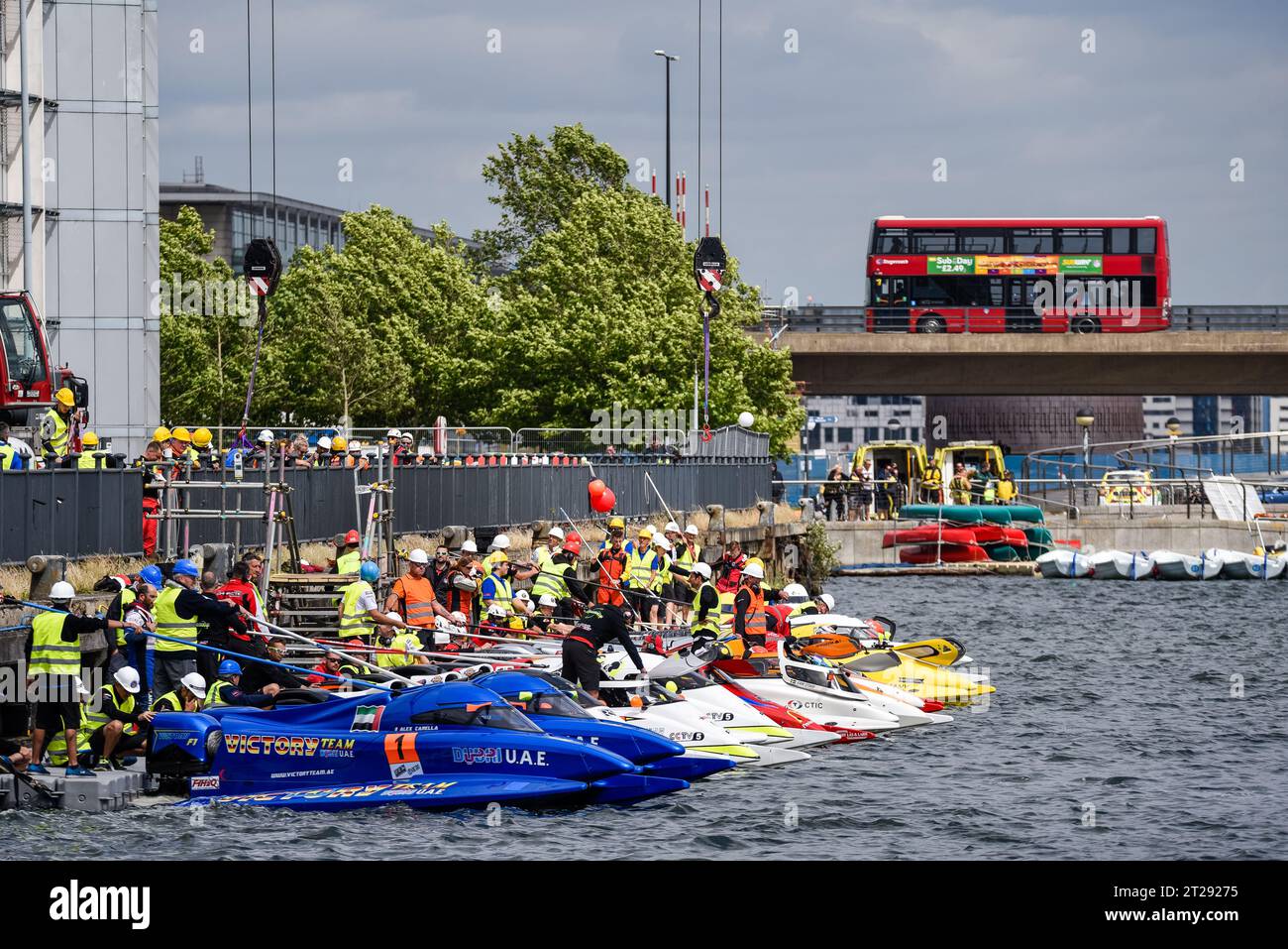 Speedboats at the casting off pontoon for the F1H2O Formula 1 Powerboat Grand Prix of London at Royal Victoria Dock, Newham, London, UK. London bus Stock Photo