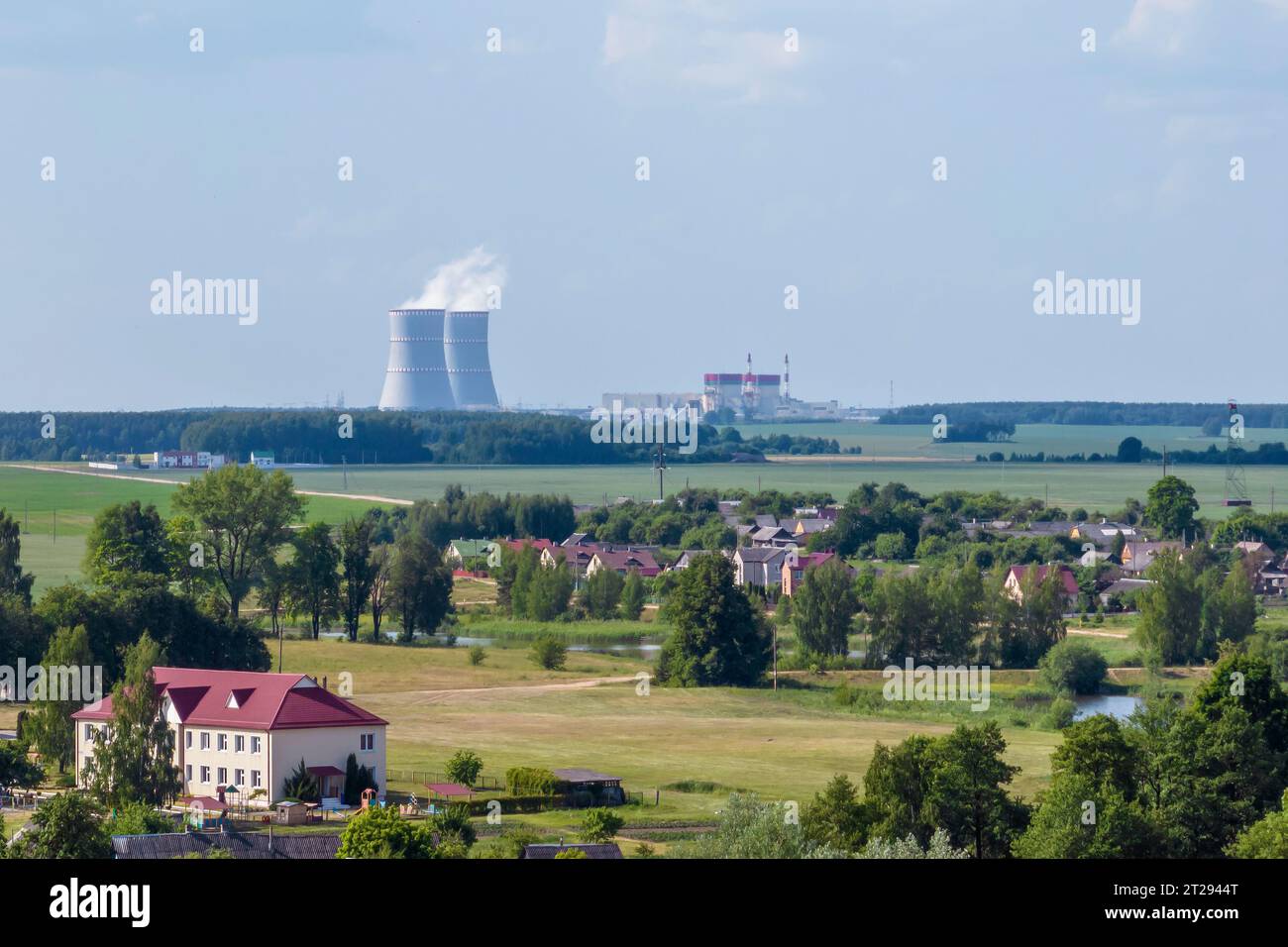 Cooling towers of nuclear power plant against the blue sky Stock Photo ...
