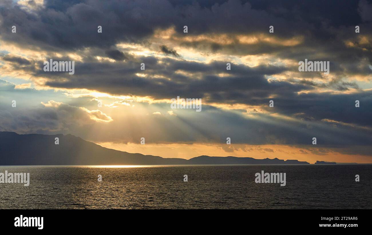 Sunrays breaking through clouds hi-res stock photography and images - Alamy