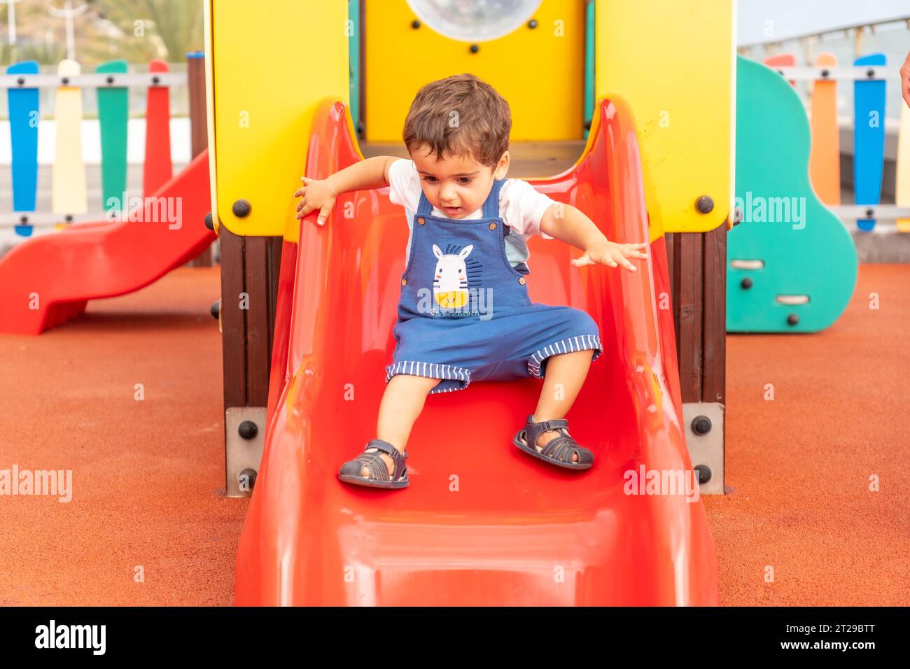 Boy playing in the playground hi-res stock photography and images - Alamy