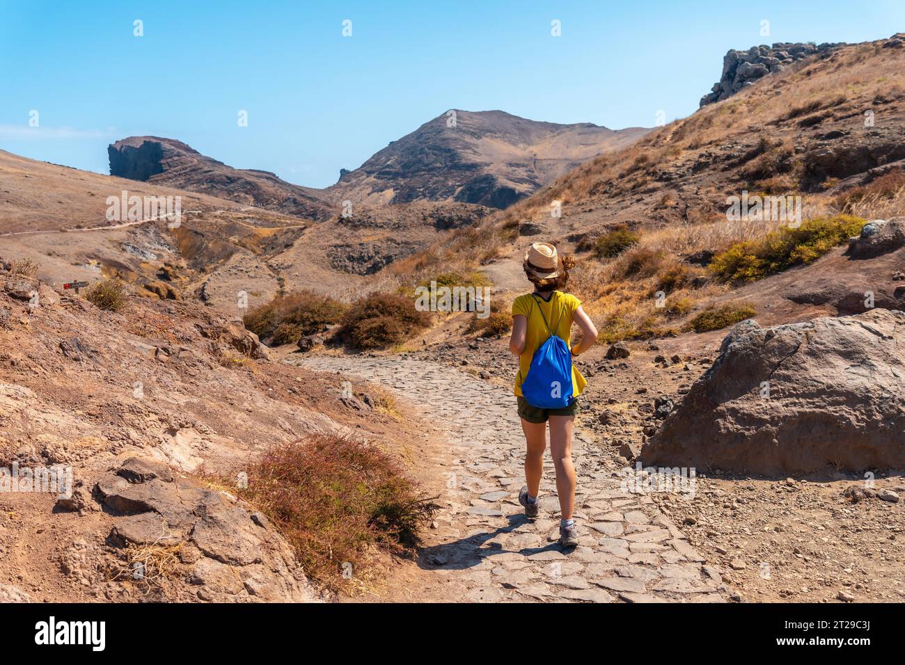 A young woman on a trekking trail in Ponta de Sao Lourenco, Madeira coast Stock Photo