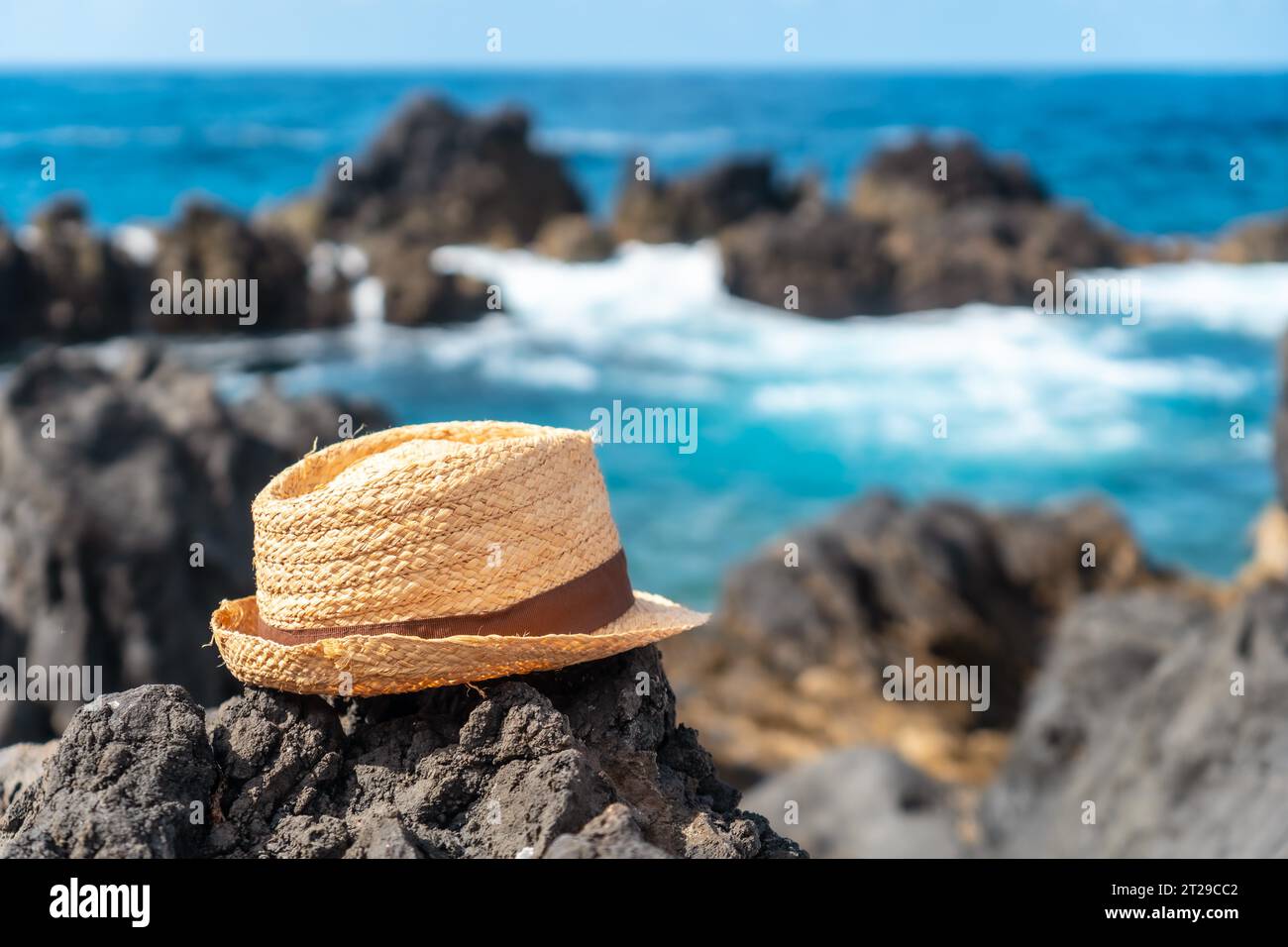 Hat next to a natural pool in summer, coastal town of Porto Moniz, Madeira Stock Photo