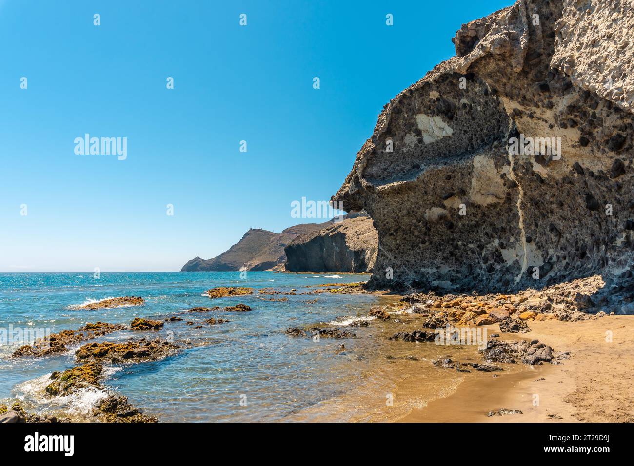 Summer at Monsul Beach in the Cabo de Gata Natural Park, created with eroded lava formations in the municipality of San Jose, Almeria. Spain Stock Photo