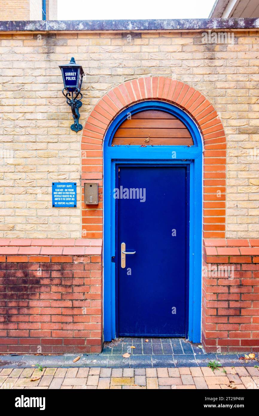 Blue door leading into the custody suite at the police station in Staines-upon-Thames in Surrey, UK Stock Photo