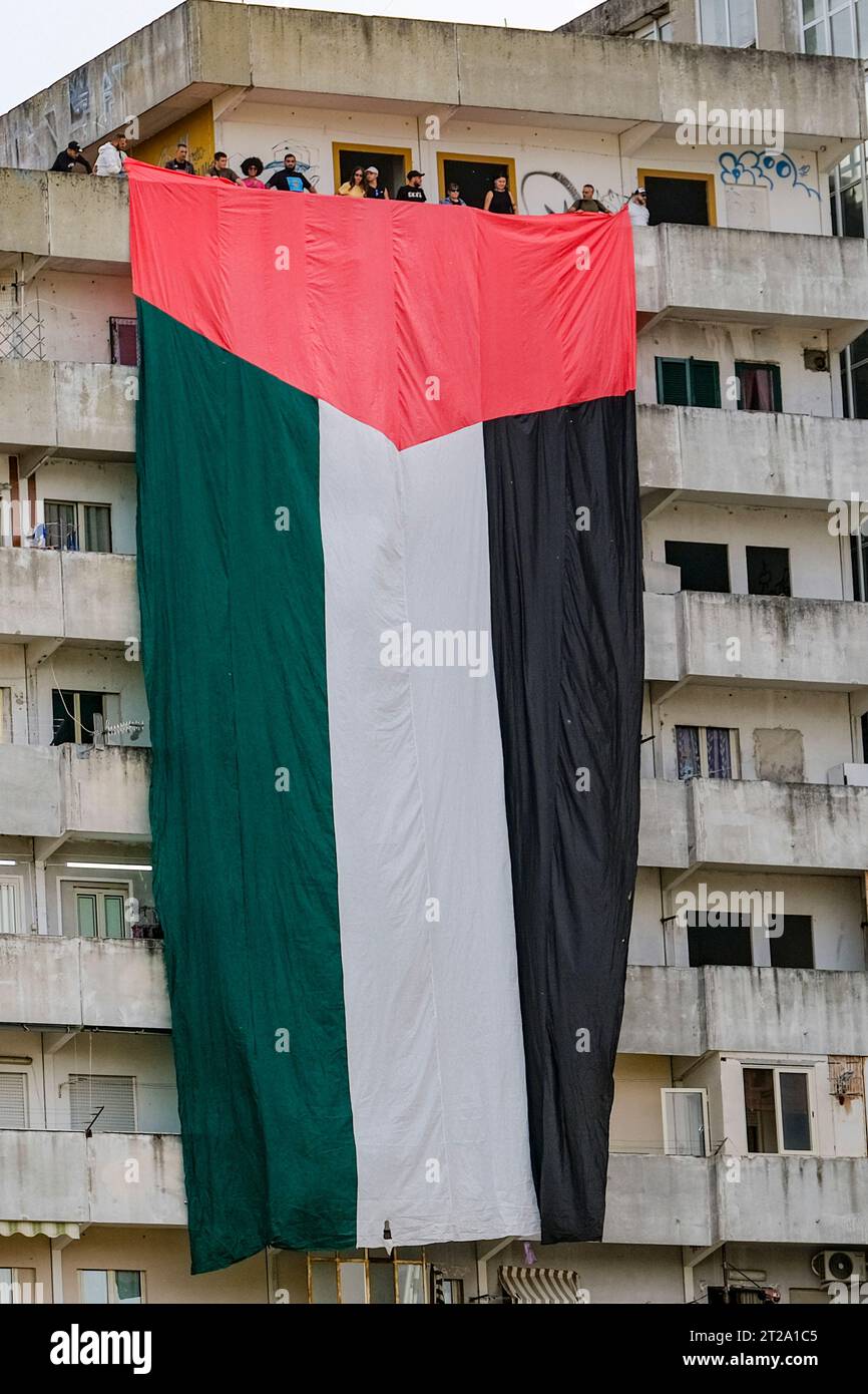 A large flag of about 30 metres with the colours of Palestine was displayed for a few minutes on the Vele in Scampia, at the initiative of activists of the Network for Palestine. About forty activists were present. The flag was displayed for a few minutes and then removed, attracting the attention of passers-by. Stock Photo