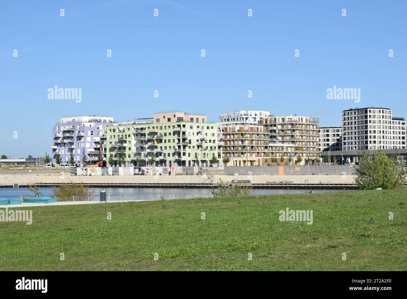 VIENNA, AUSTRIA - OCTOBER 2, 2023: Residential buildings and the lake in Seestadt Aspern, one of Europe's largest urban development areas. Stock Photo