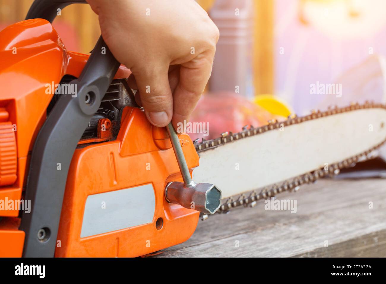 Correct chain tension using the special tool on the chainsaw bar. Chain