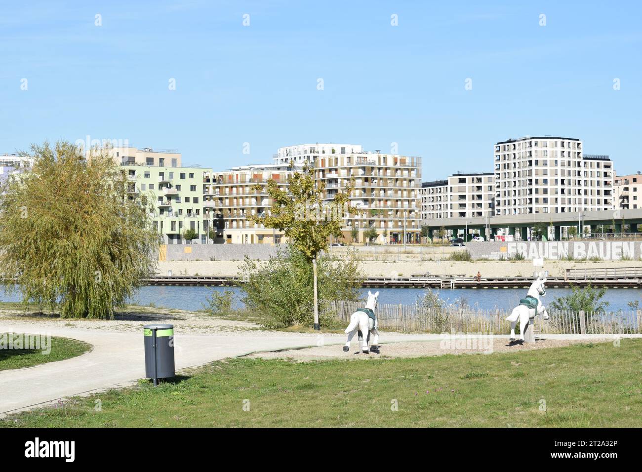 VIENNA, AUSTRIA - OCTOBER 2, 2023: Residential buildings and the lake in Seestadt Aspern, one of Europe's largest urban development areas. Stock Photo