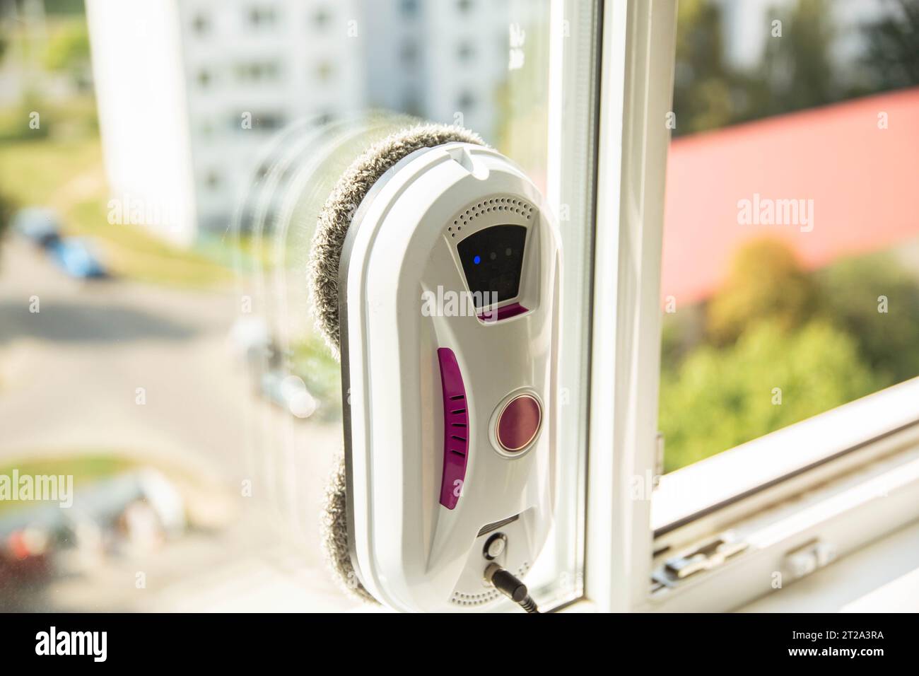 Modern device for cleaning glass from dirt and streaks. Robot washer