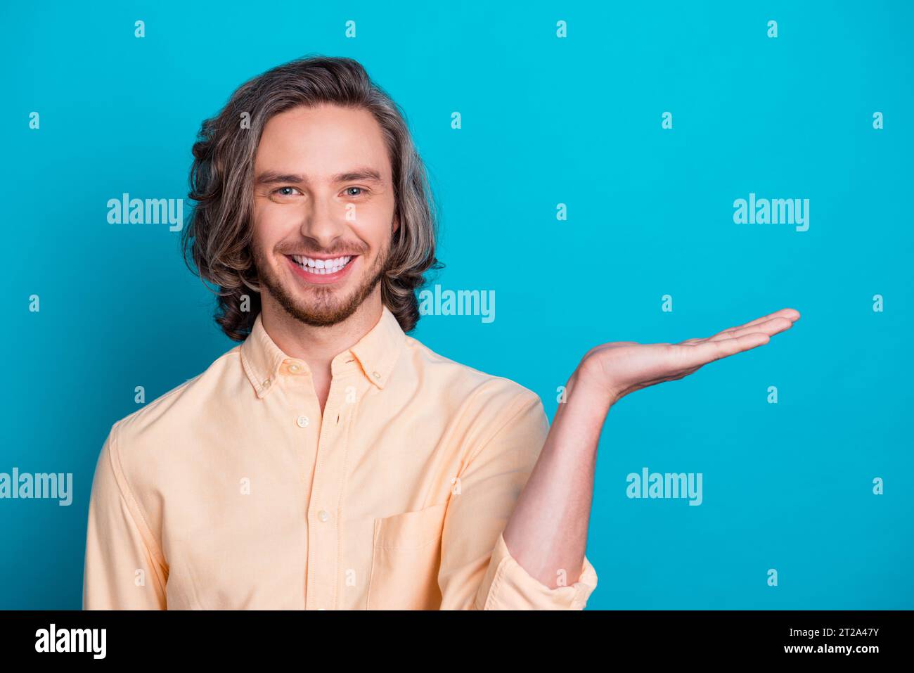 Portrait of toothy beaming guy with long haircut wear stylish shirt ...