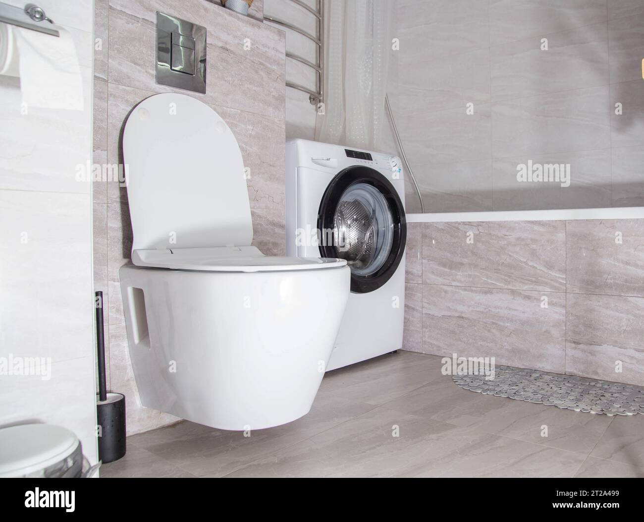 Modern renovation in the bathroom combined with a toilet. Hanging