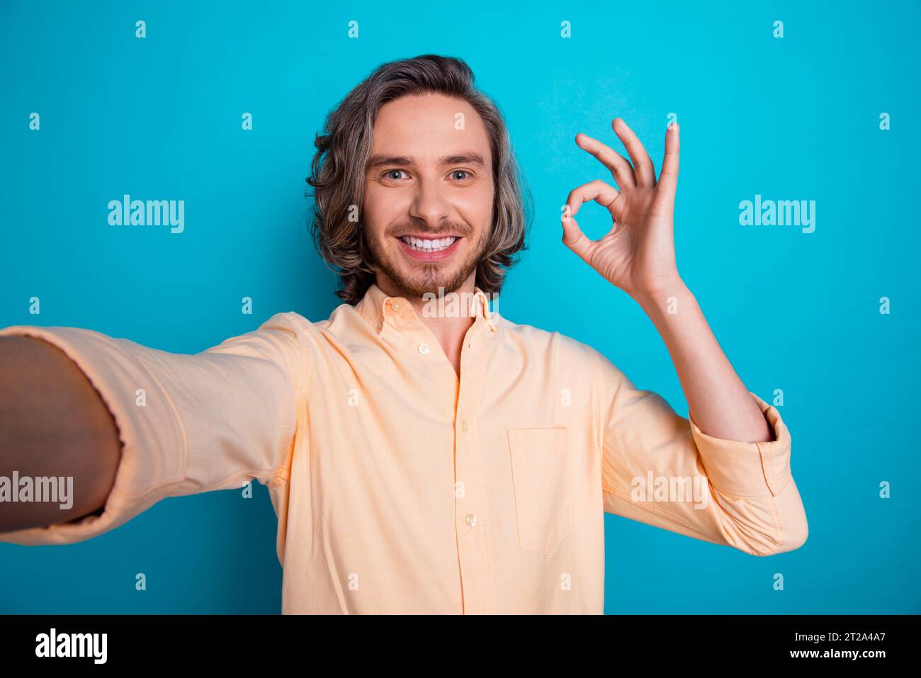 Portrait of toothy beaming nice guy with long haircut wear stylish ...