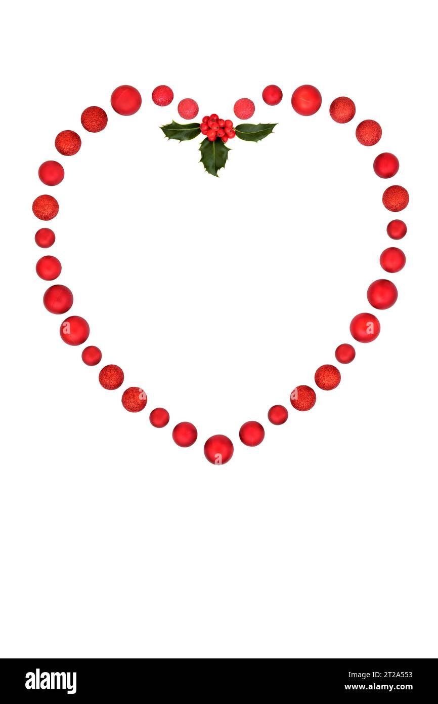 Christmas heart wreath, red bauble ball decorations and holly sprig. Minimal romantic symbol on white background. Greeting card, menu, invitation, gif Stock Photo