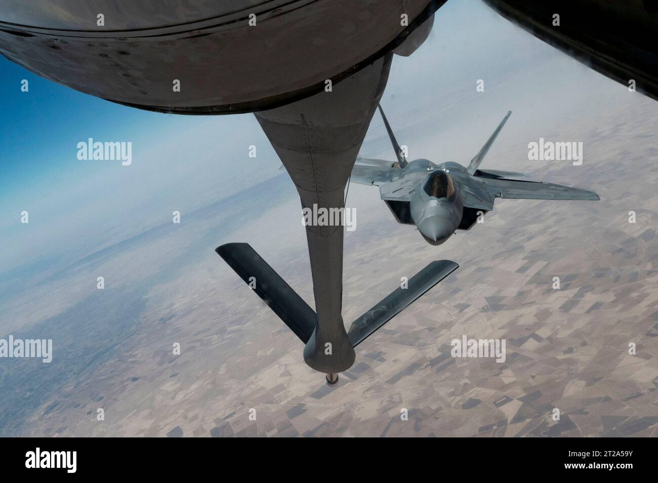 Area of Control, Syria. 27 June, 2023. A U.S. Air Force F-22 Raptor fighter aircraft approaches a KC-135 Stratotanker for aerial refueling during a patrol over Central Command area of responsibility, June 27, 2023 in Syria.  Credit: SSgt. Emily Farnsworth/Planetpix/Alamy Live News Stock Photo