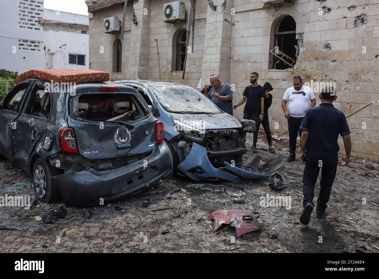 Gaza City, Palestinian Territories. 18th Oct, 2023. Palestinians inspect the destruction following the attack on the Ahli Arab Hospital, which killed dozens of civilians. Credit: Mohammad Abu Elsebah/dpa/Alamy Live News Stock Photo