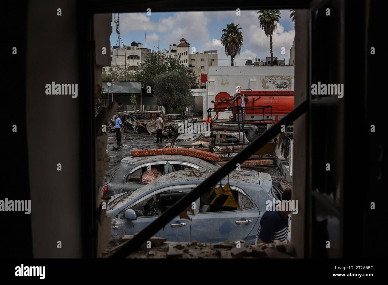 Gaza City, Palestinian Territories. 18th Oct, 2023. Palestinians inspect the destruction following the attack on the Ahli Arab Hospital, which killed dozens of civilians. Credit: Mohammad Abu Elsebah/dpa/Alamy Live News Stock Photo