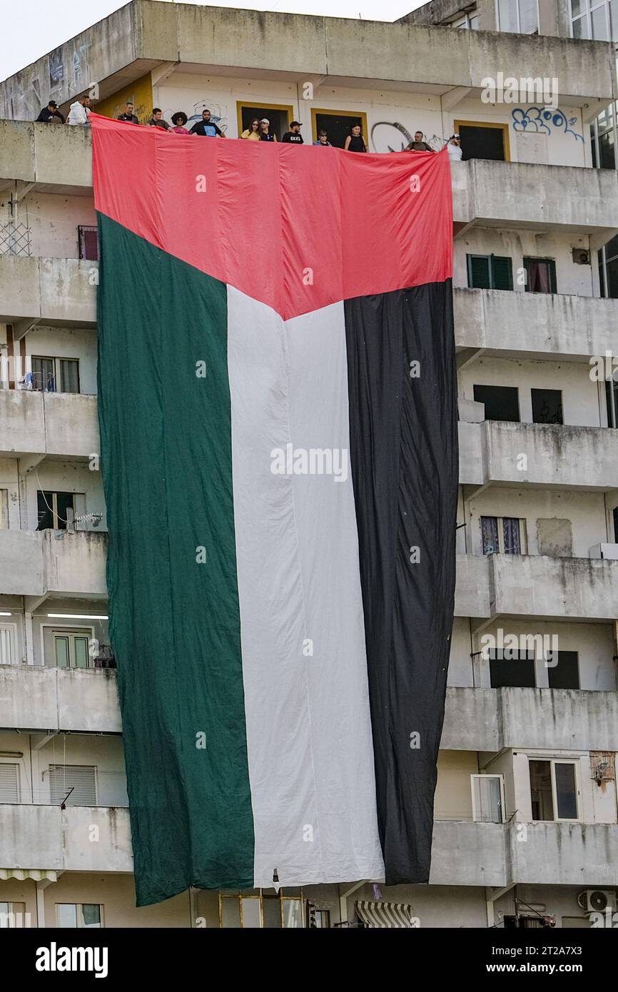Napoli, Italy. 18th Oct, 2023. A large flag of about 30 metres with the colours of Palestine was displayed for a few minutes on the Vele in Scampia, at the initiative of activists of the Network for Palestine. About forty activists were present. The flag was displayed for a few minutes and then removed, attracting the attention of passers-by. Credit: Live Media Publishing Group/Alamy Live News Stock Photo