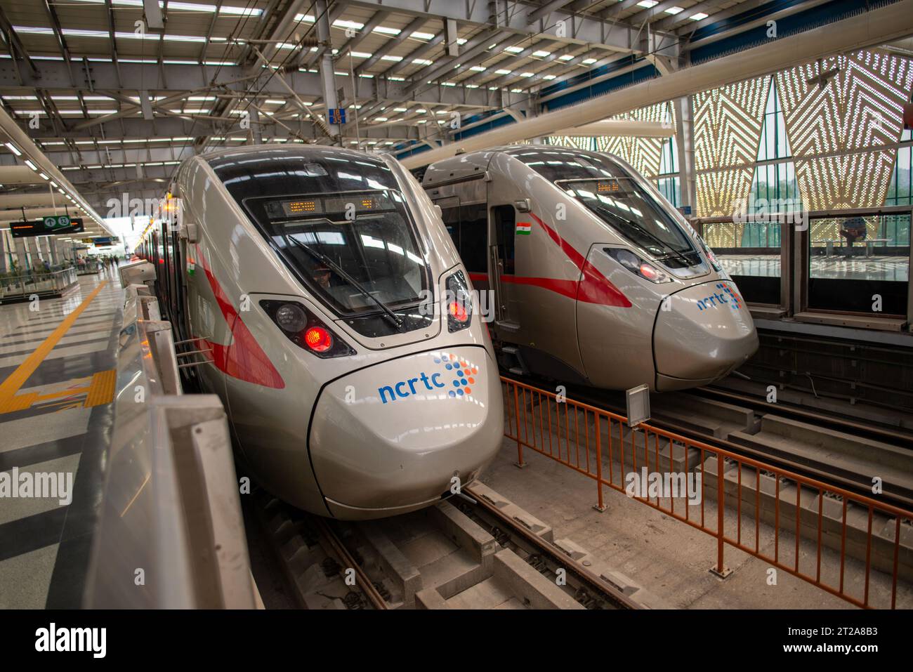 A fast train from the Regional Rapid Transit System is at Sahibabad ...