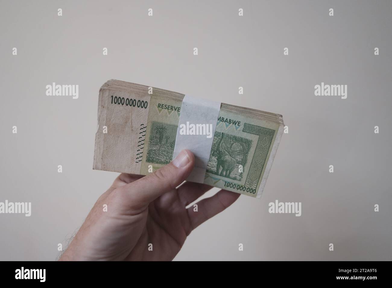 Stacks of Cash - Millions, Billions of Dollars. Zimbabwe Dollars after hyper inflation. Each note is One Billion Dollars Stock Photo