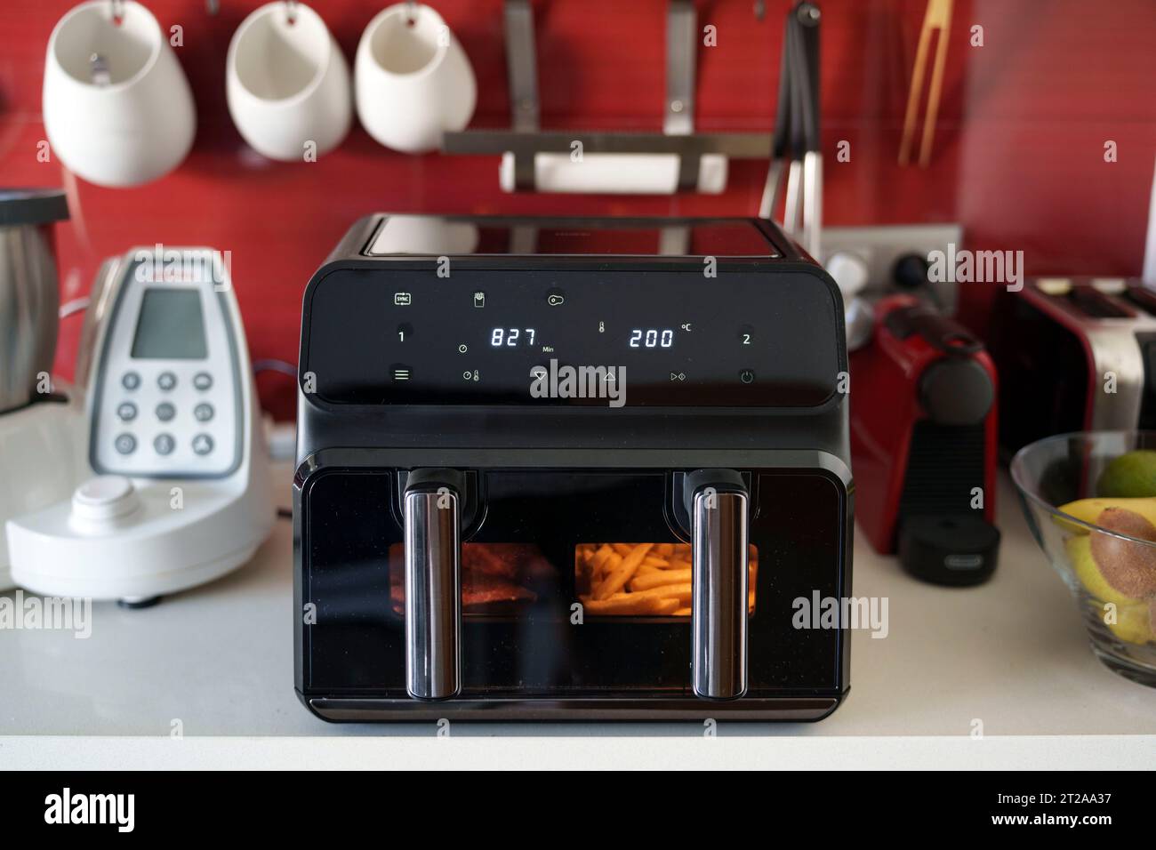 Large double tray air fryer on a kitchen countertop Stock Photo Alamy
