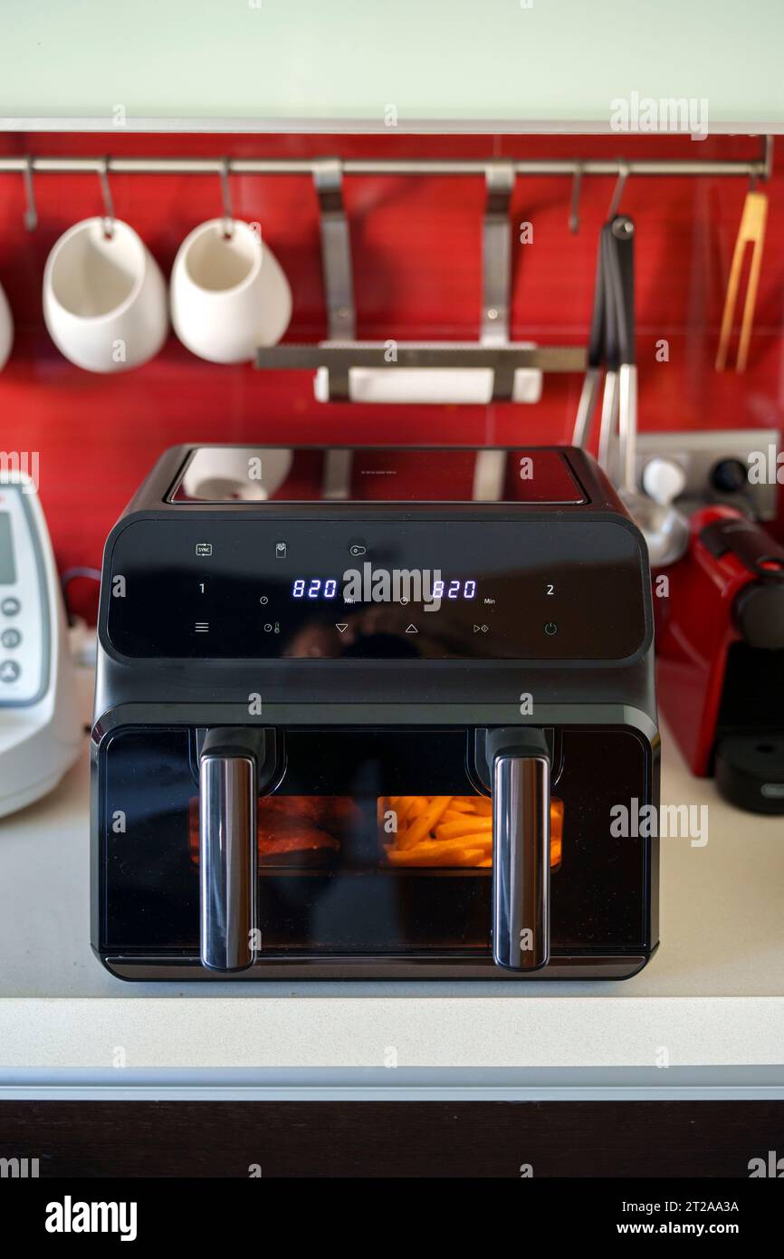 Large double tray air fryer on a kitchen countertop Stock Photo Alamy