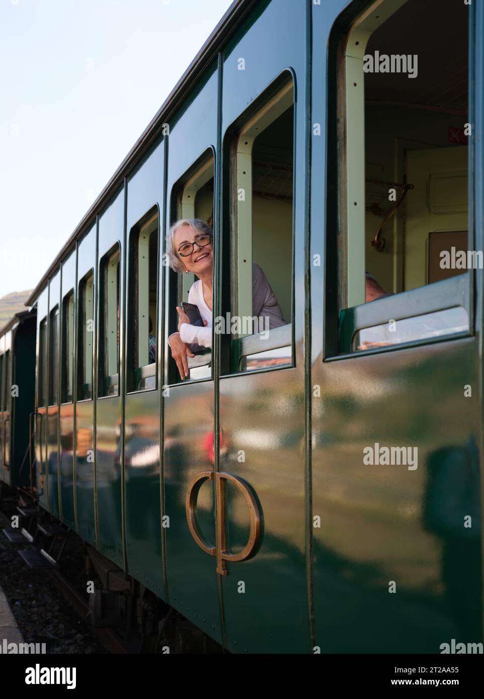 Passenger looking out of the window of the Douro Historical Train running between Régua and Tua following the River Douro, Portugal, Europe Stock Photo