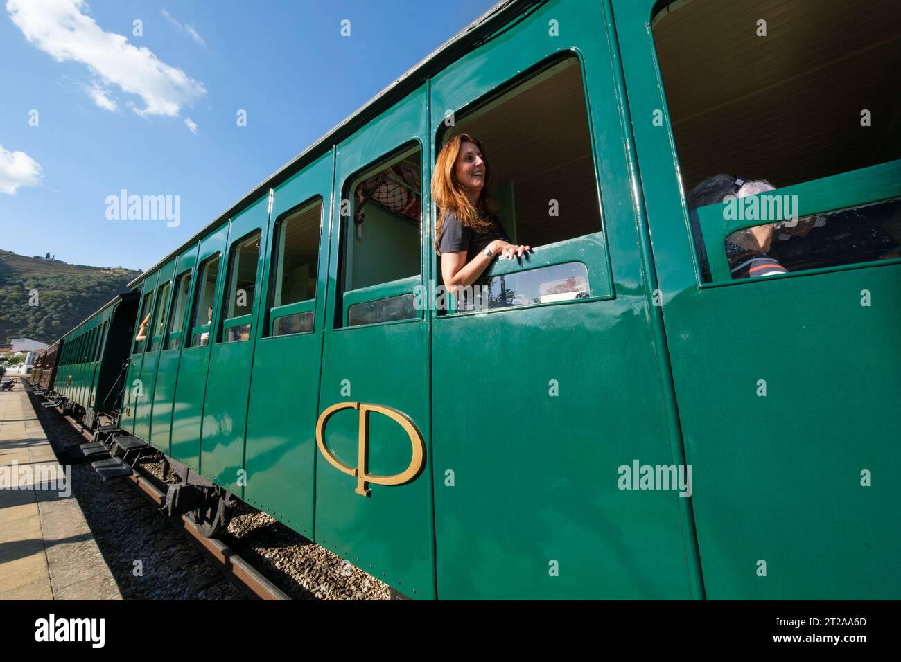 Passenger looking out of the window of the Douro Historical Train running between Régua and Tua following the River Douro, Portugal, Europe Stock Photo