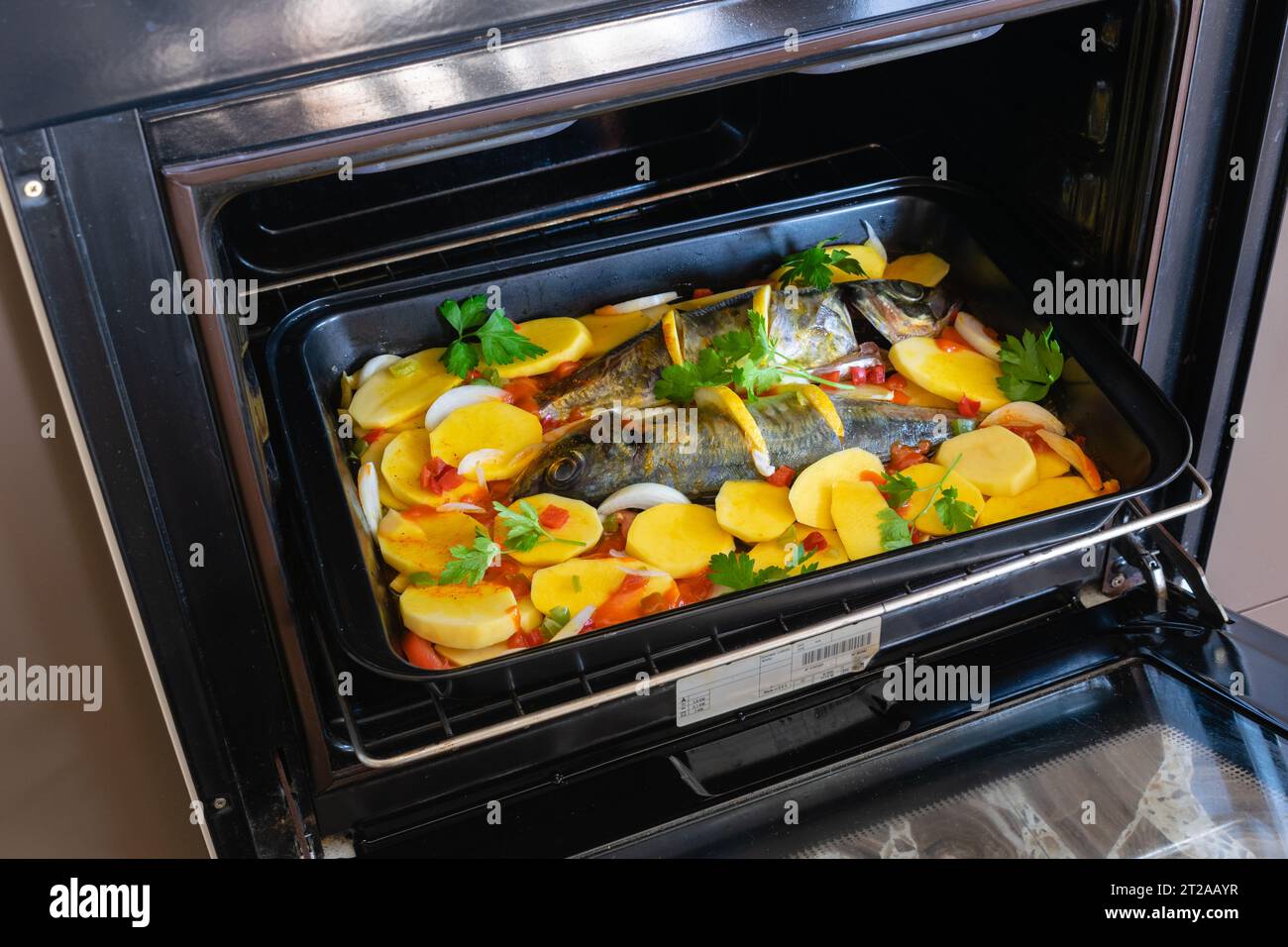 Delicious raw mackerel with potatoes and tomato, onion, lemon and