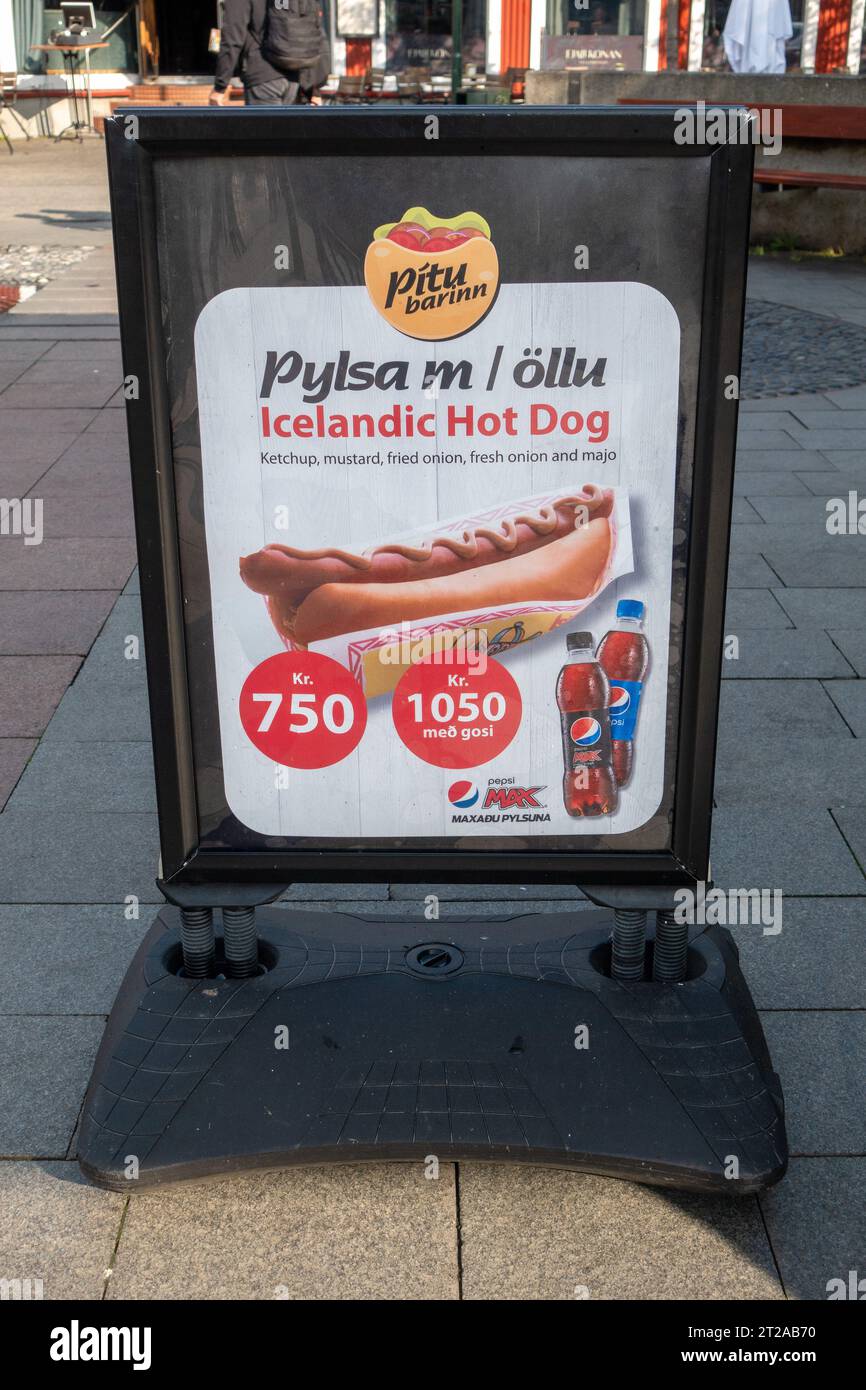 Advertising Sign Icelandic Hot Dog (Pylsa), Special Offer Combo With Pepsi Max, Pavement Sidewalk Advertising Sign Fast Food In Downtown Reykjavik Ice Stock Photo
