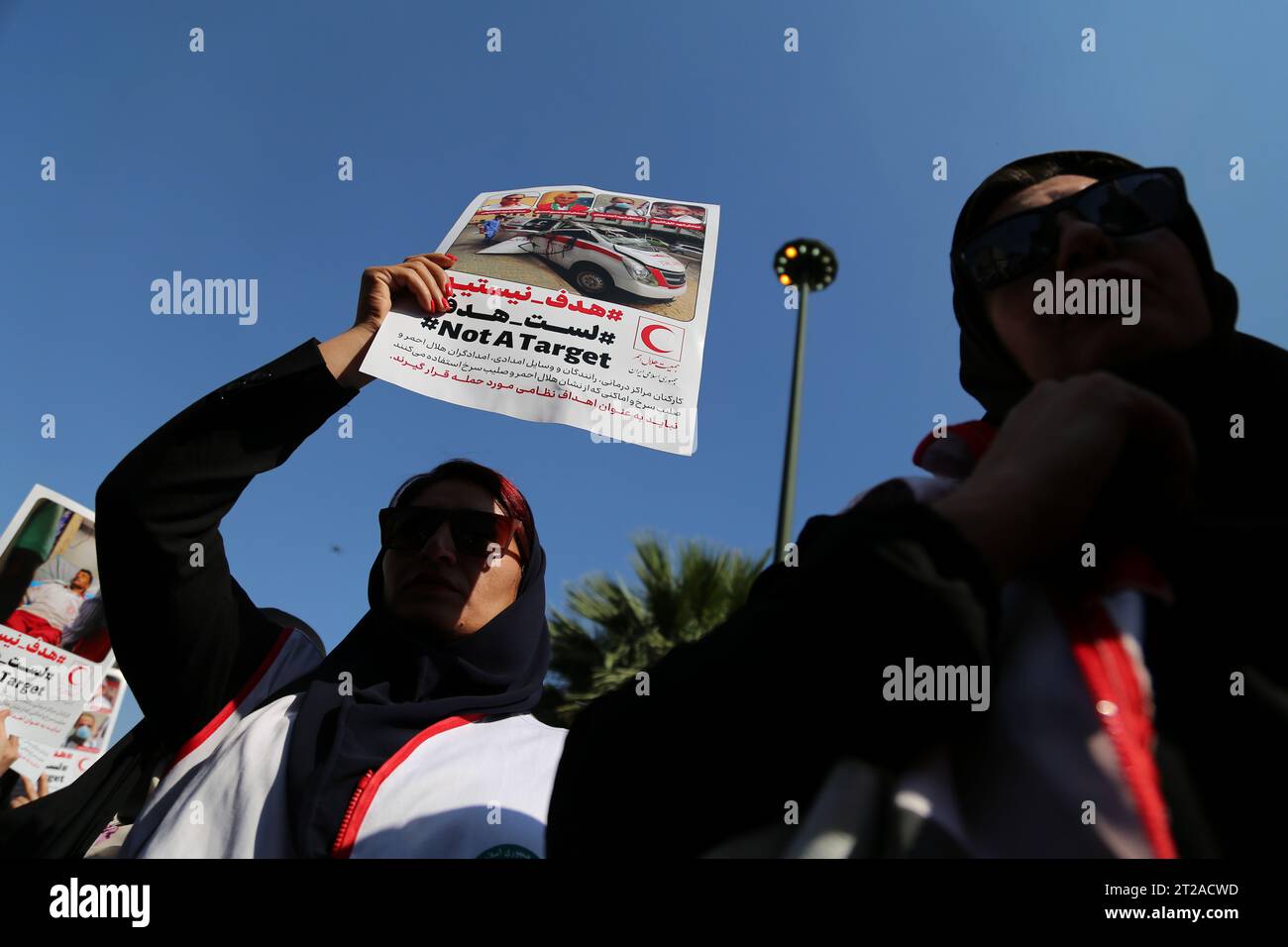 Tehran, Iran. 18th Oct, 2023. Demonstrators rally in support of Palestinians at Palestine Square in downtown Tehran. The protest erupted after Hamas-led authorities in Gaza said hundreds of people had been killed in an Israeli strike on a hospital in Gaza on 17 October. According to the Israel Defense Forces (IDF), the Islamic Jihad is responsible for the failed rocket launch that hit the hospital. Israel's arch-foe Iran, which backs both Hamas and Lebanon-based Hezbollah militants, has repeatedly warned against a Gaza invasion and raised on October 16 the specter of a possible ''pre-emptive Stock Photo