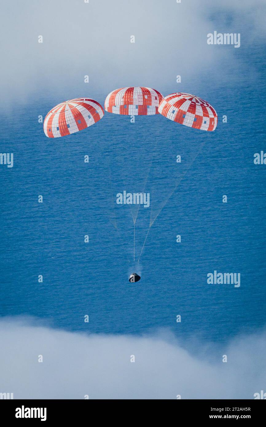 Orion Splashdown. At 12:40 p.m. EST, Dec. 11, 2022, NASA’s Orion spacecraft for the Artemis I mission splashed down in the Pacific Ocean after a 25.5 day mission to the Moon. Orion will be recovered by NASA’s Landing and Recovery team, U.S. Navy and Department of Defense partners aboard the USS Portland. Stock Photo