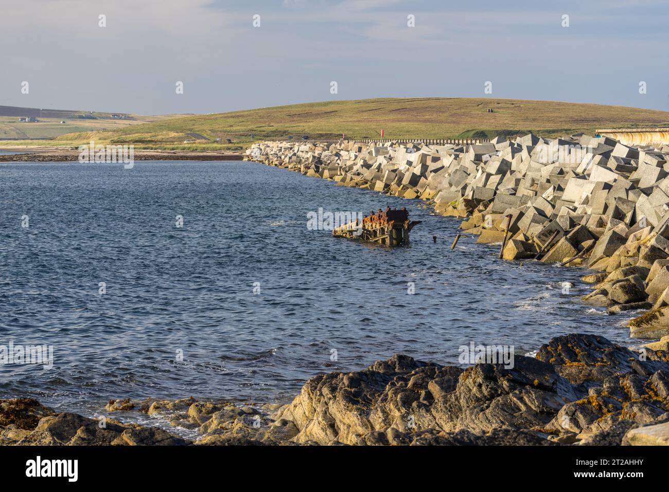 Churchill Barrier 2 and Rusting Sunken Ship from Lambs Holm, Scapa Flow, Orkney Islands, Scotland, UK Stock Photo